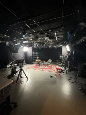 Studio lighting — black box set with rigging and fixtures