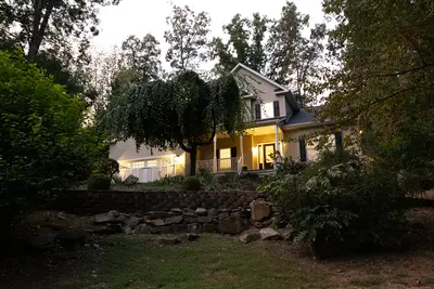 Twilight real estate photo — garden and rear exterior